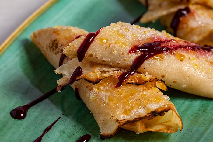 Traditional Asturian style apple filled frixuelos crepes